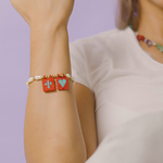 Load image into Gallery viewer, Pulsera Perlas y Banderines Rojos P639